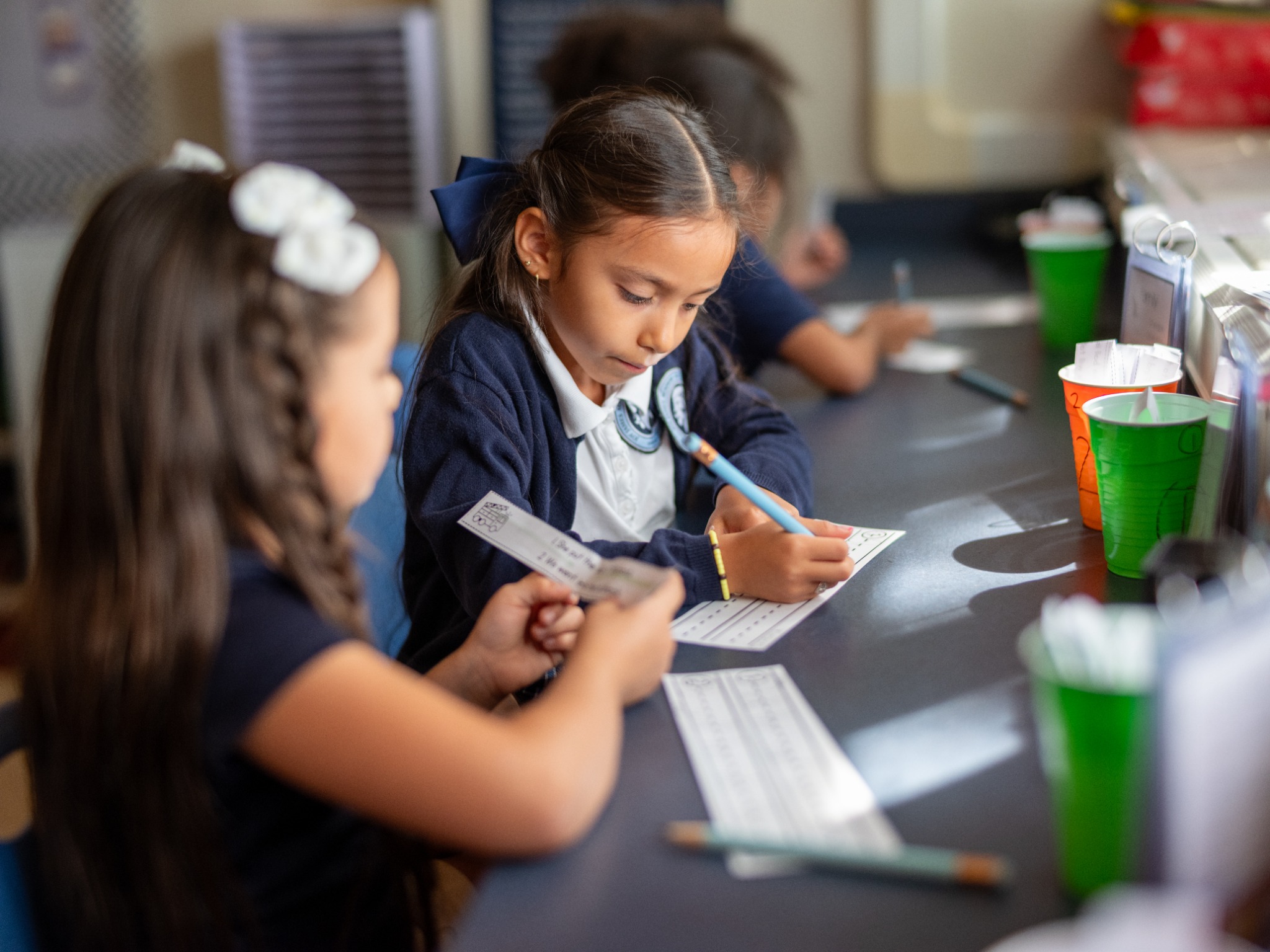 Two students working together during a literacy activity