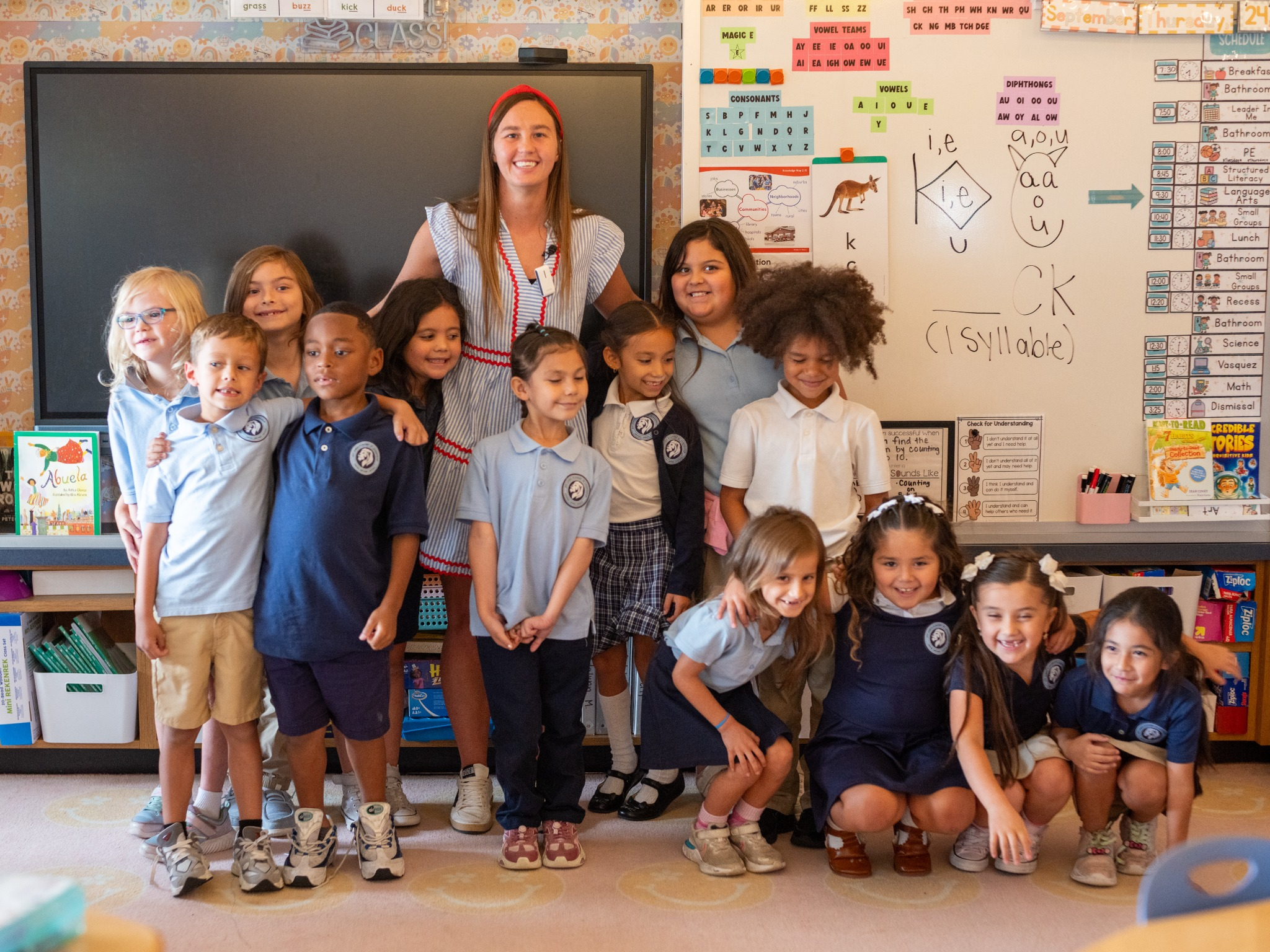Teacher with elementary students in a literacy classroom